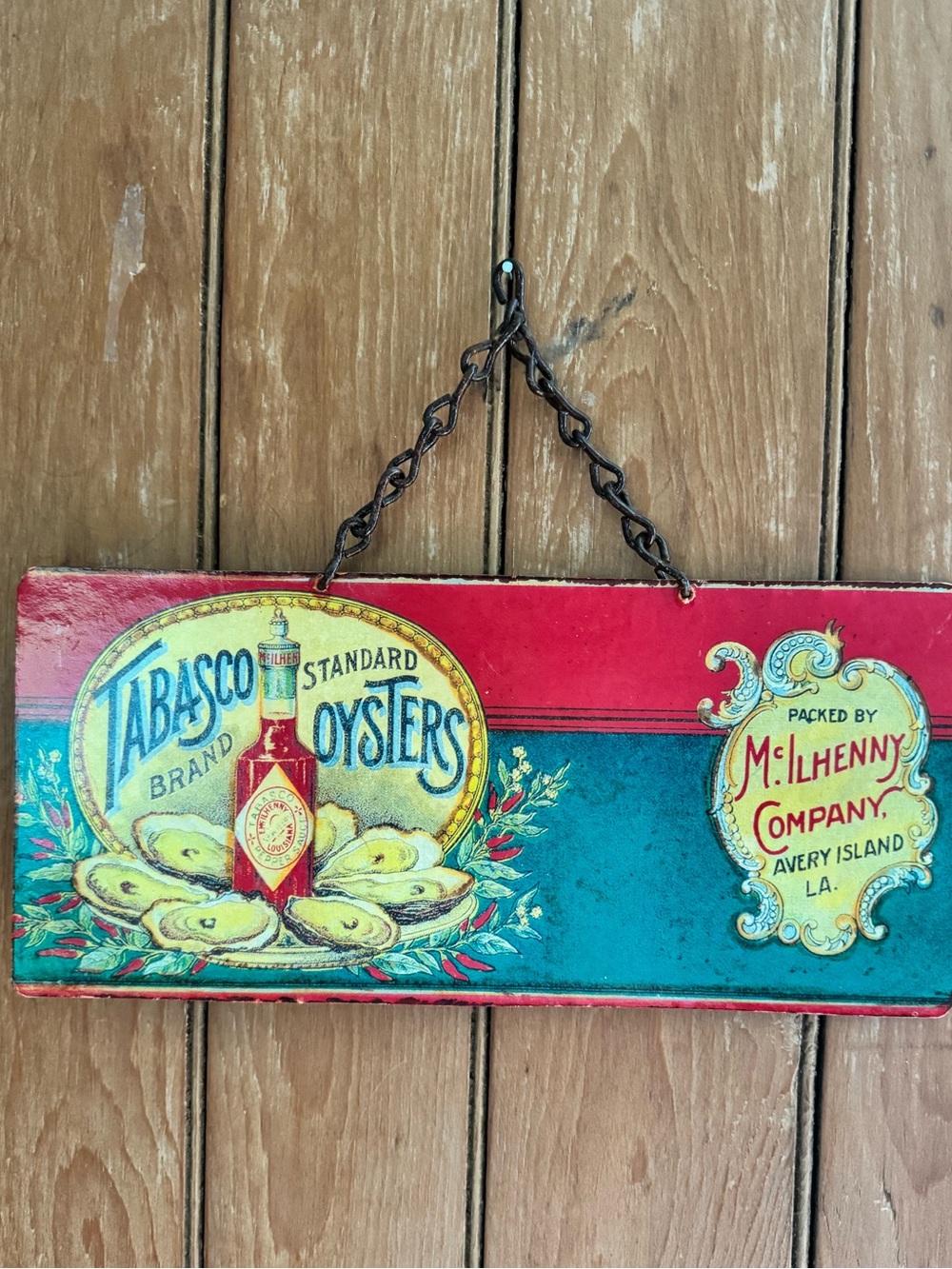 Metal chain hanging wall decor sign Tabasco Sauce with oysters on a plate image